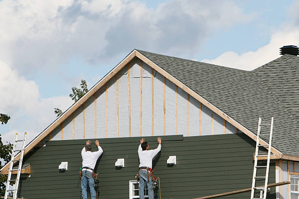 Professional Siding Installation technician working in Phoenix, IL